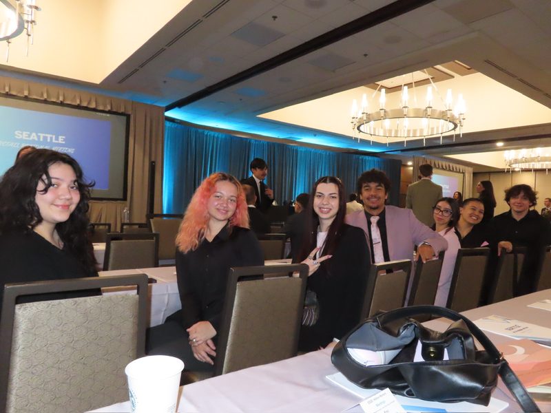 Chosen Innovations team members seated together at a regional sales and marketing meeting
